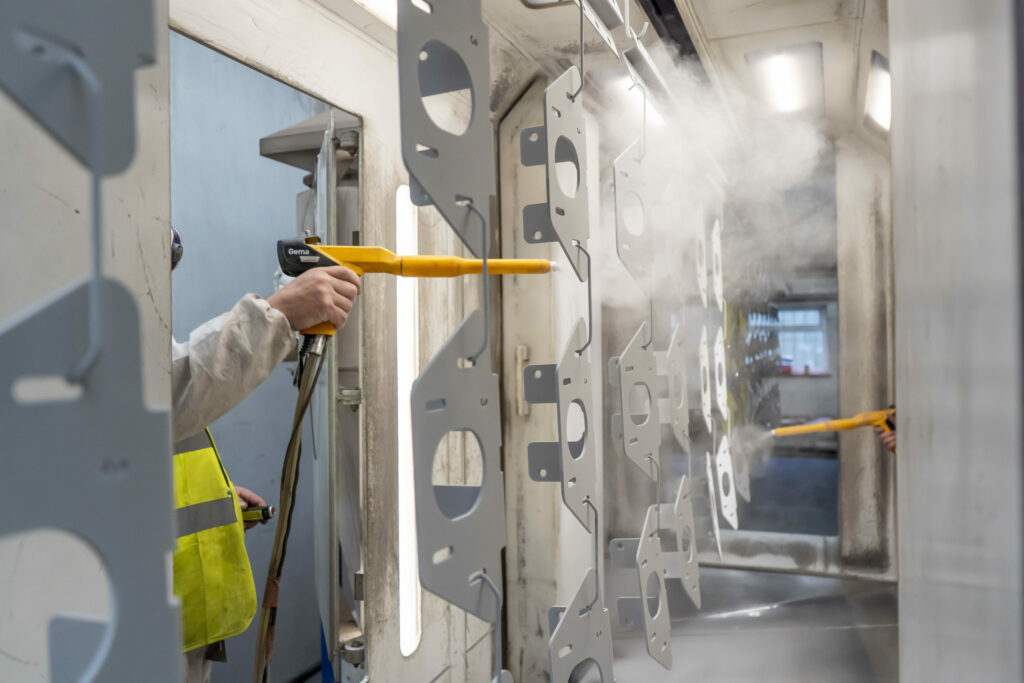 A photo of a powder coating process at Kingsward Group